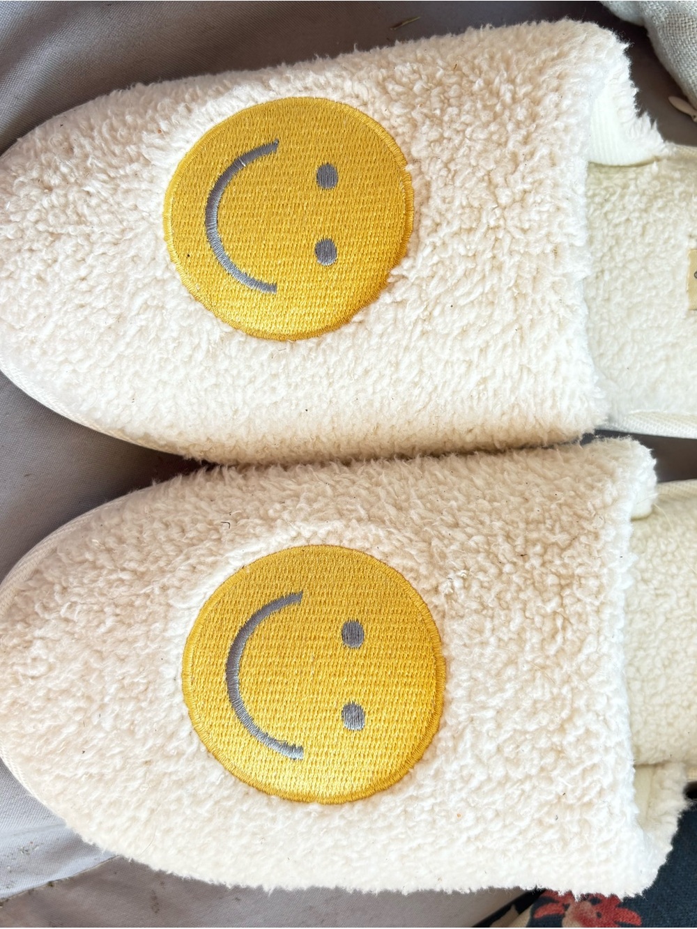dearfoams Cream Sherpa Slip-On Slippers with Yellow Smiley Patch